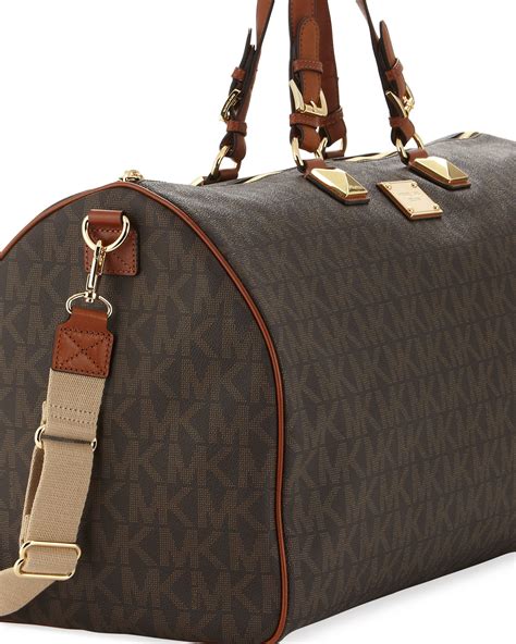 michael kors jet set travel duffel bag|Michael Kors bag with airplanes.